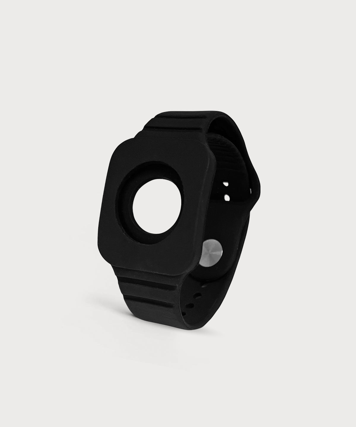 Eloop Band als schwarzes Silikonarmband mit rundem Einsatz und verstellbarem Verschluss auf hellem Hintergrund