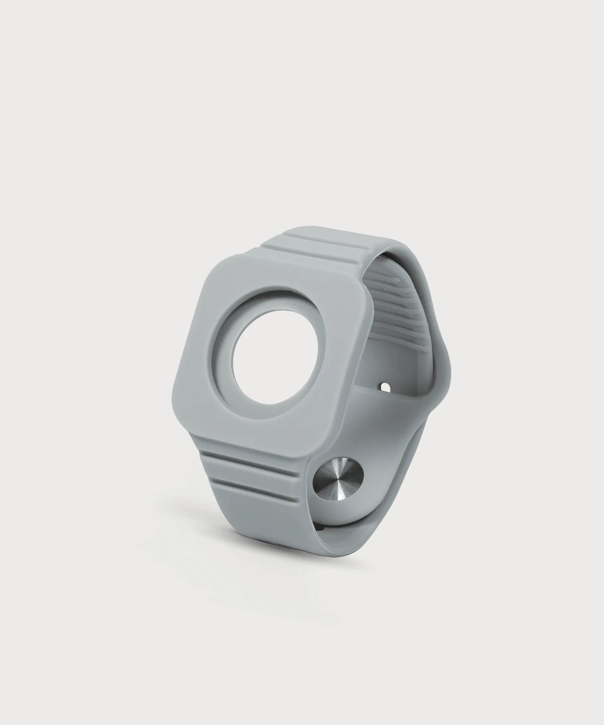 Eloop Band als graues Silikonarmband mit rundem Einsatz und verstellbarem Verschluss auf hellem Hintergrund