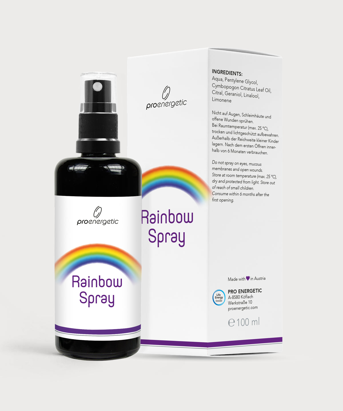 Rainbow Spray in schwarzer Sprühflasche mit Regenbogenetikett, daneben weiße Produktverpackung mit Inhaltsangaben auf hellem Hintergrund