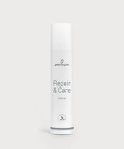 Weißer zylindrischer Spender mit ProEnergetic Logo und Aufschrift Repair & Care Cream auf hellem Hintergrund.